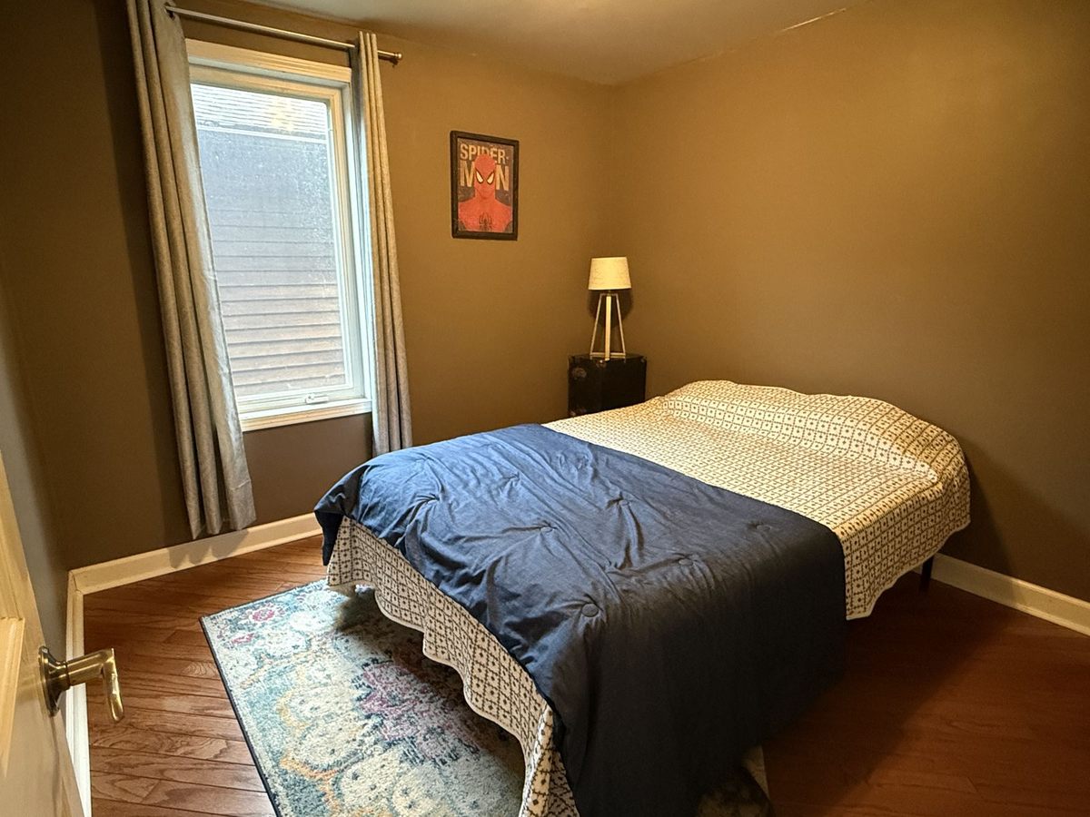 Second main-floor bedroom with full-size bed