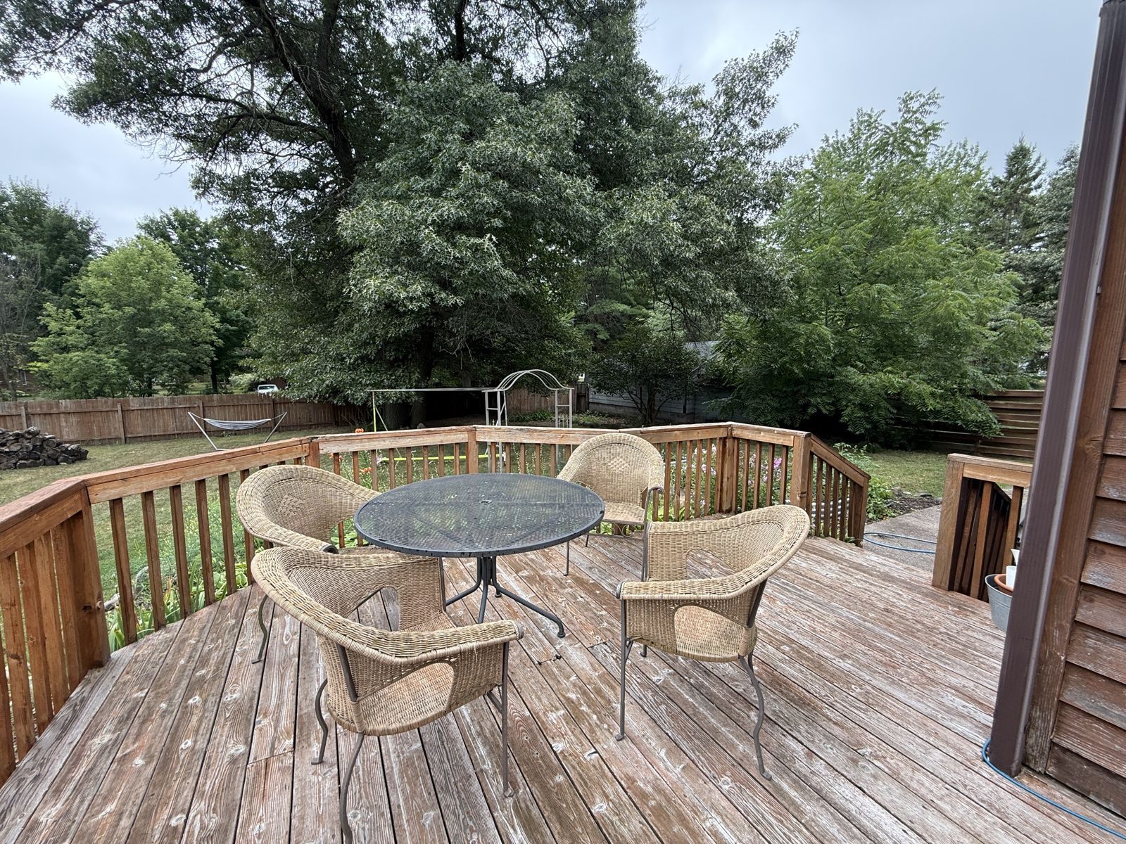 Deck overlooking the fully fenced backyard at The Pine City House