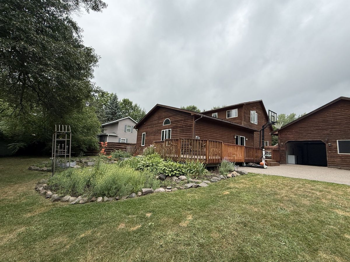 Back of the house and fenced yard