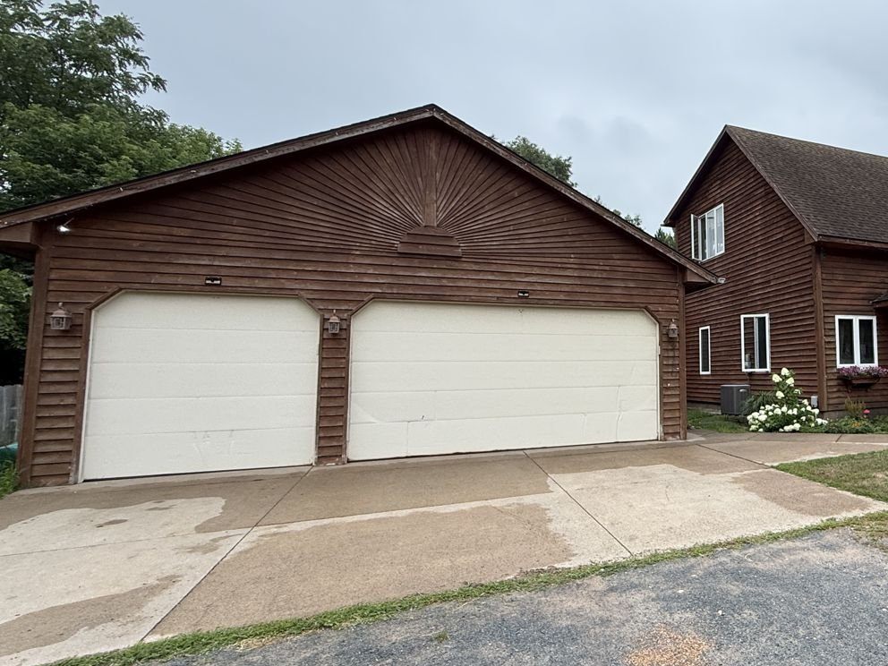 Front view of the 3-car garage and driveway