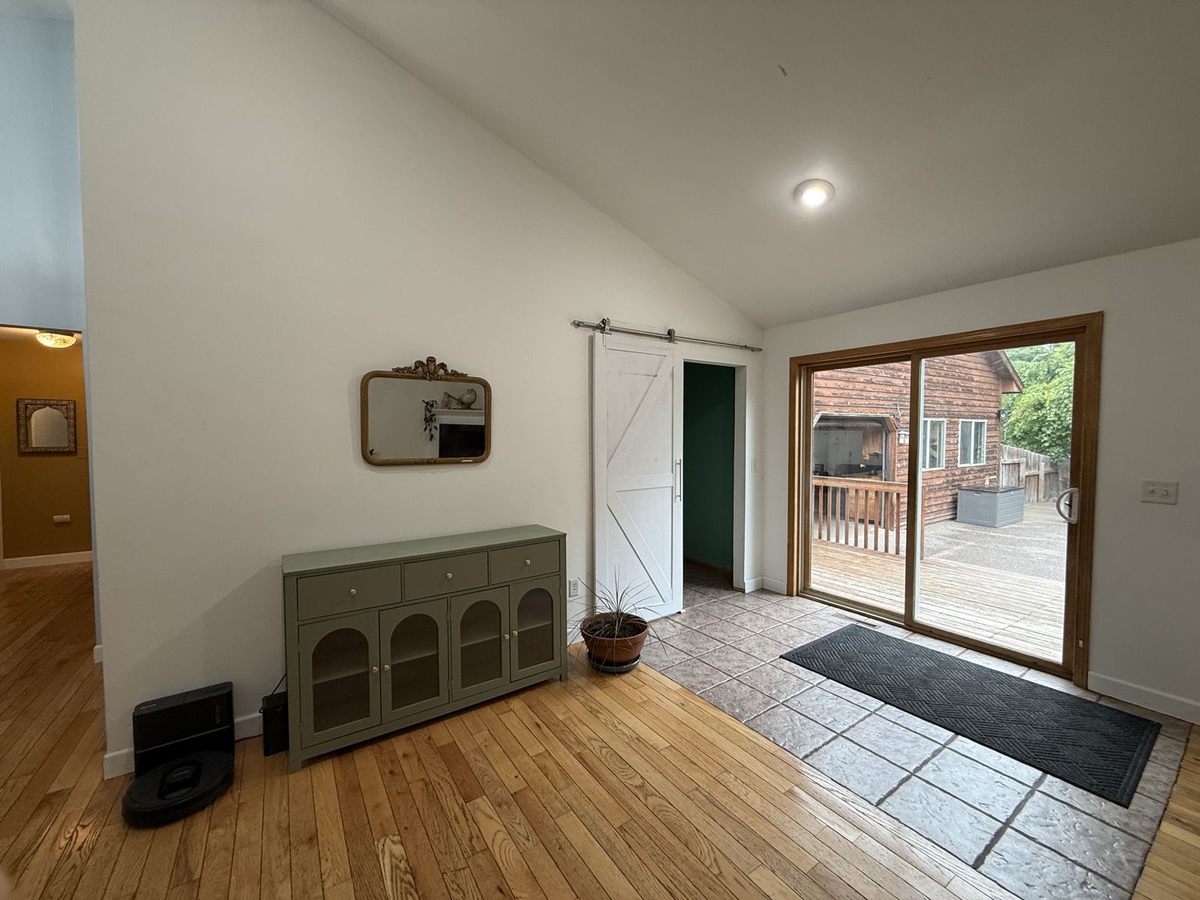 Living room sliding door out to the backyard